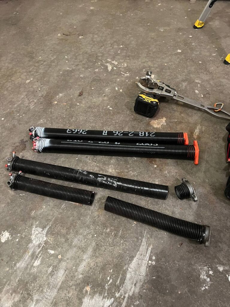 new and broken garage door springs